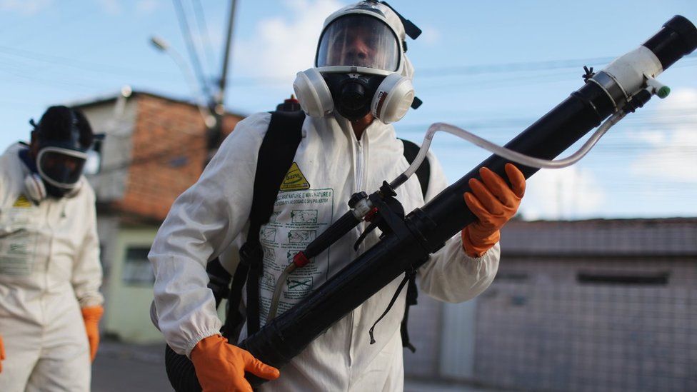 Health workers fumigate in an attempt to eradicate the mosquito which transmits the Zika virus on January 28, 2016 in Recife, Pernambuco state, Brazil. Two two-man teams were fumigating in the city today. Health officials believe as many as 100,000 people have been exposed to the Zika virus in Recife, although most never develop symptoms.