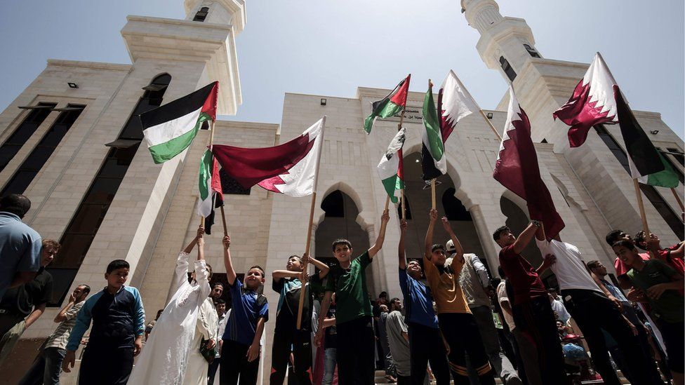 Palestinians attend a rally in support of Qatar, at the Qatari-funded housing project in the southern Gaza Strip city of Khan Yunis on June 9, 2017.