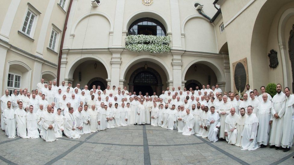 Pope Francis poses with priests at the Jasna Gora monastery