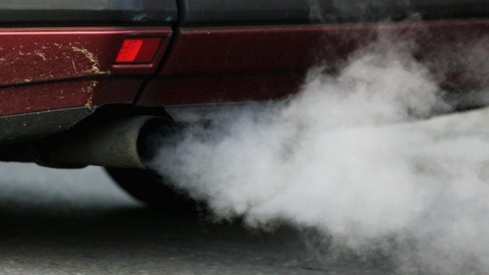 A car exhaust emitting fumes