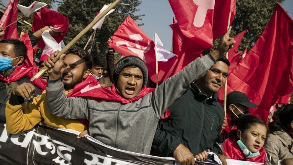 Nepalese Communist activists take a part in a rally against the dissolution of parliament in Kathmandu, Nepal