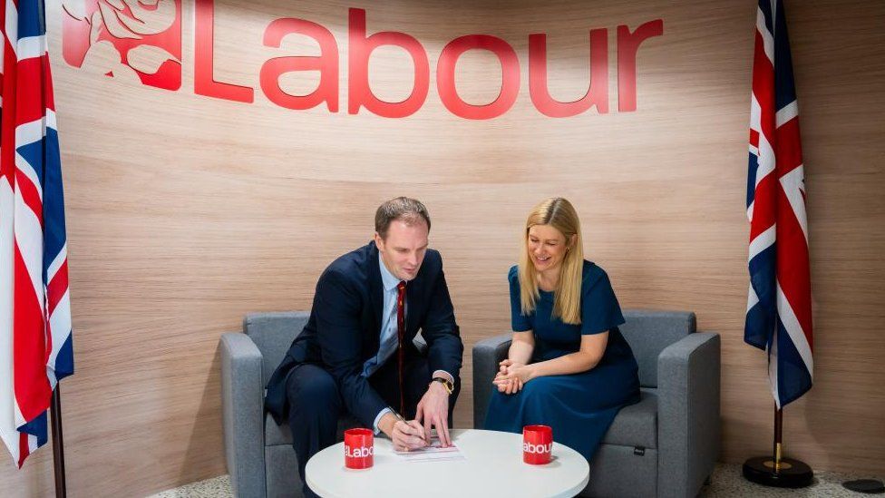 Dan Poulter MP signs a form to become a member of the Labour Party