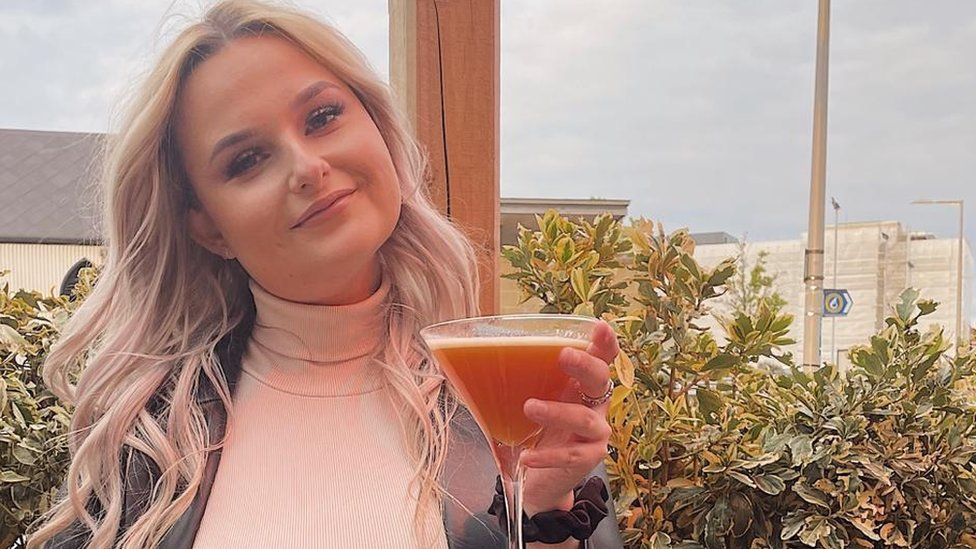 Image of Ffion Morgan holding a drink