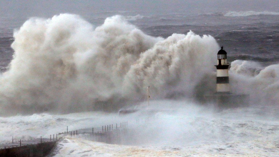 Huge waves crash against the pier wall at Seaham Lighthouse during Storm Arwen, in Seaham, County Durham