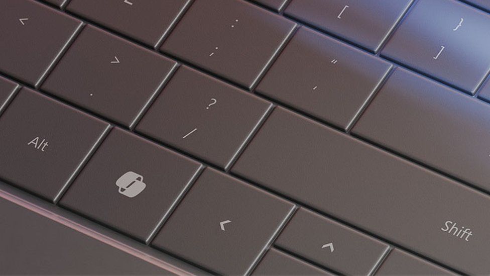 A close up of the Copilot key on a keyboard