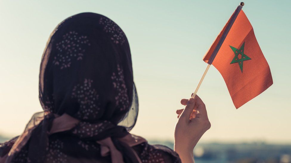 Woman holding flag