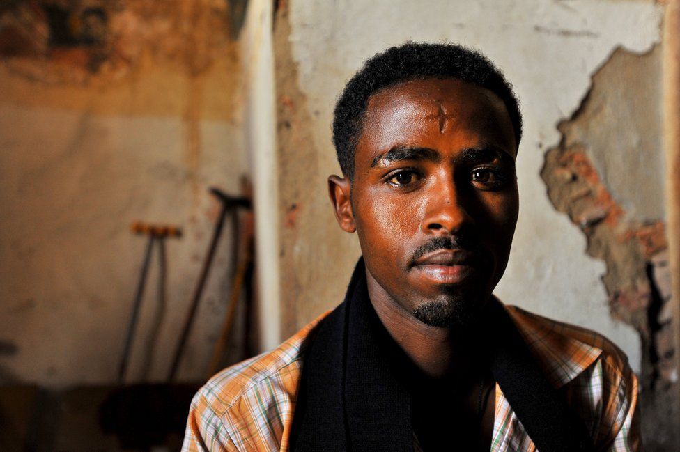 Young Christian man from Ethiopia who has carved a cross into his forehead