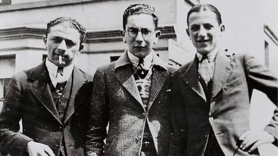 Sonny Leopold (centre) worked with his father at the tailoring company