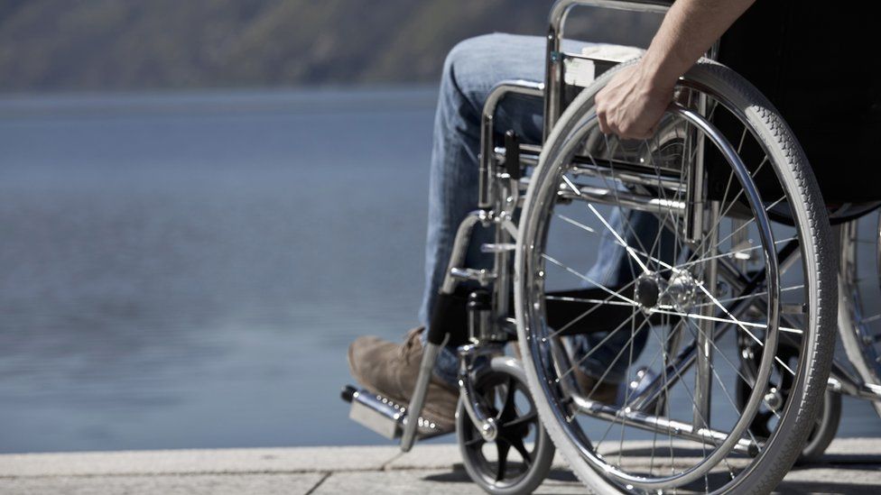 Stock photo of man in wheelchair