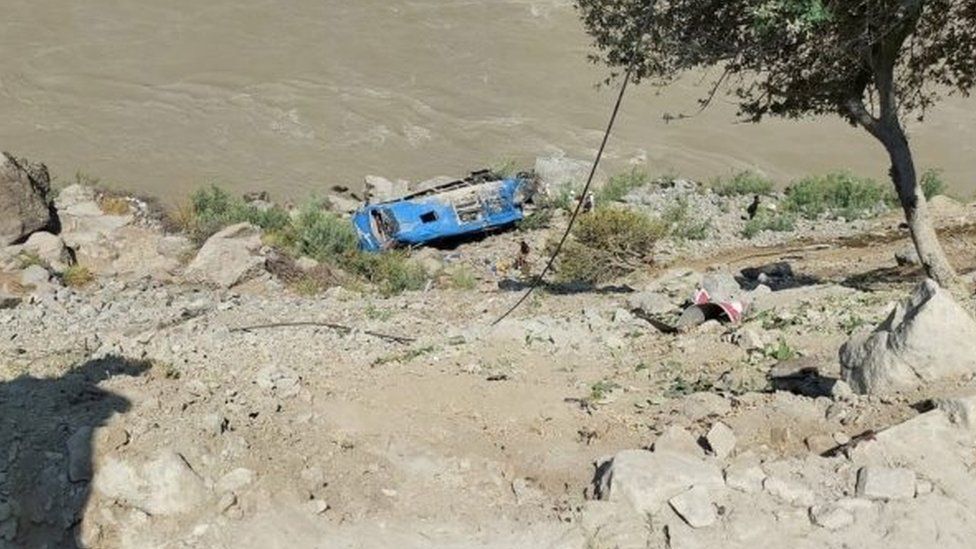 A handout photo shows wreckage of a bus that was carrying Chinese engineers to project site, after it fell into a ravine following a blast in Kohistan, Pakistan, 14 July 2021.