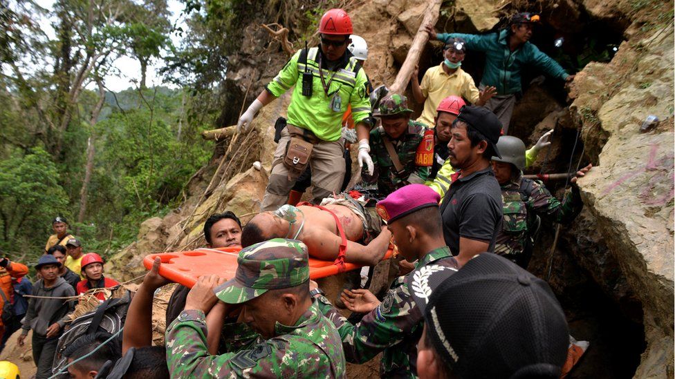 Man on stretcher at Indonesian mine