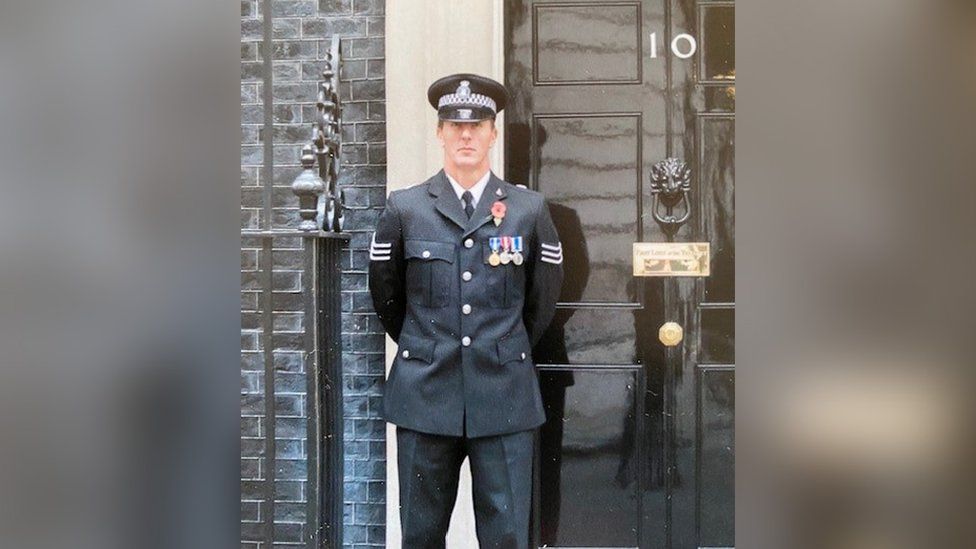 Darren Oxbrow in police uniform outside 10 Downing Street