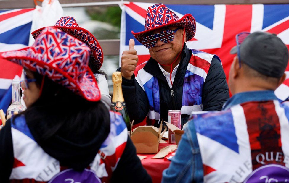People in union flag outfits at a Jubilee party in Reading
