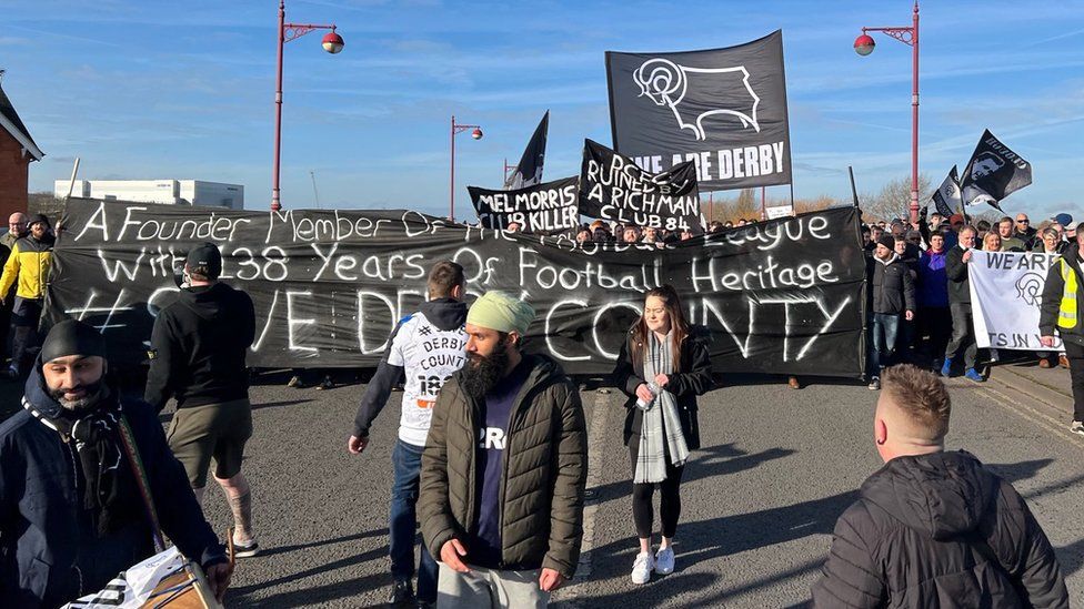 Derby County fans march to Pride Park in support of club