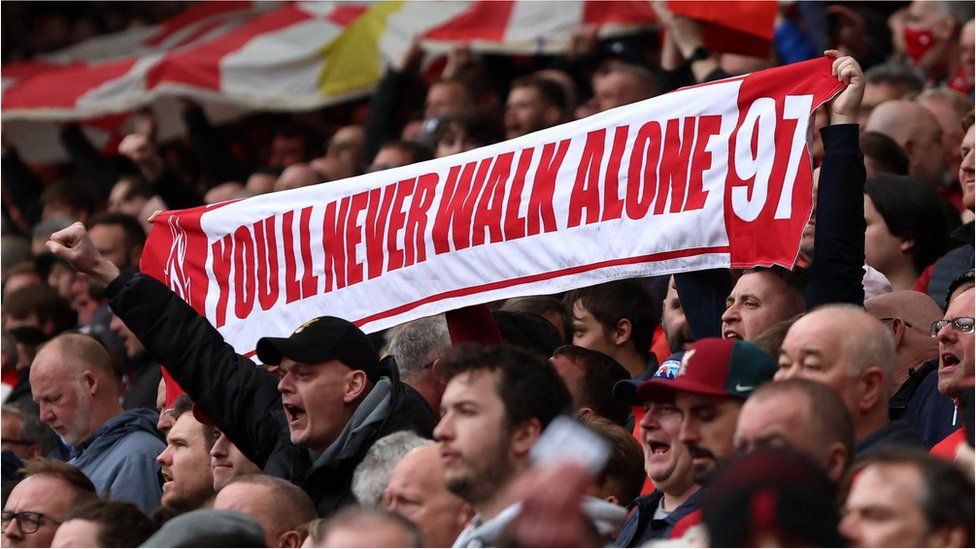 Liverpool fans with banner