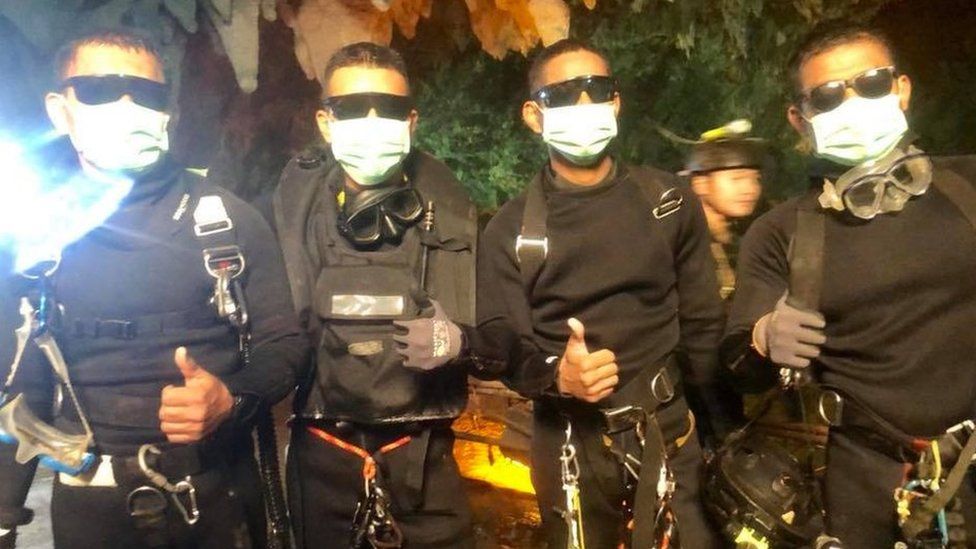 Rescue divers give the thumbs up in the cave July 2018