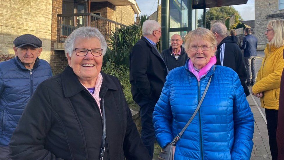 Image of Janet Stevens and Margaret Dando standing in the street smiling