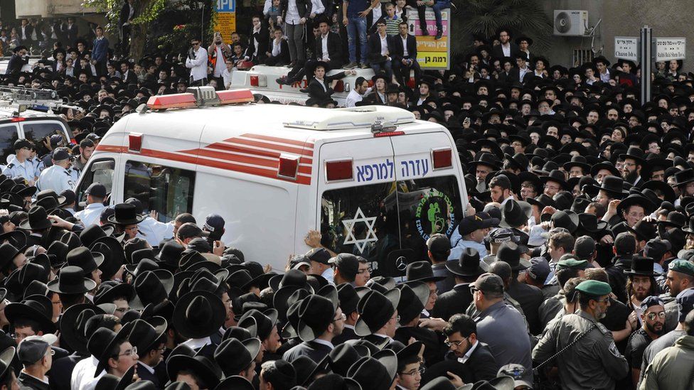 Followers of Rabbi Aharon Shteinman attend his funeral in the Israeli town of Bnei Brak on 12 December 2017