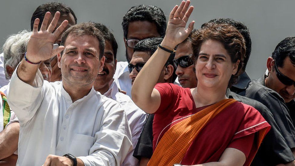 Rahul Gandhi and Priyanka Gandhi wave at the crowd in the road show after Rahul Gandhi filing nominations from Wayanad district on April 4, 2019.