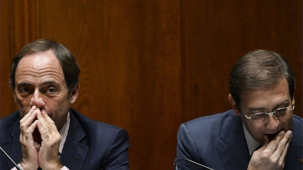 Portuguese Prime Minister Pedro Passos Coelho (right) sits beside Portuguese Vice Prime Minister Paulo Portas during a debate at the Portuguese Parliament in Lisbon on 9 November