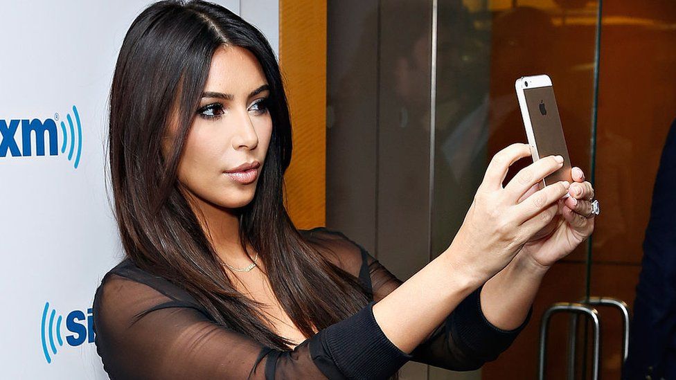 Kim Kardashian taking a selfie