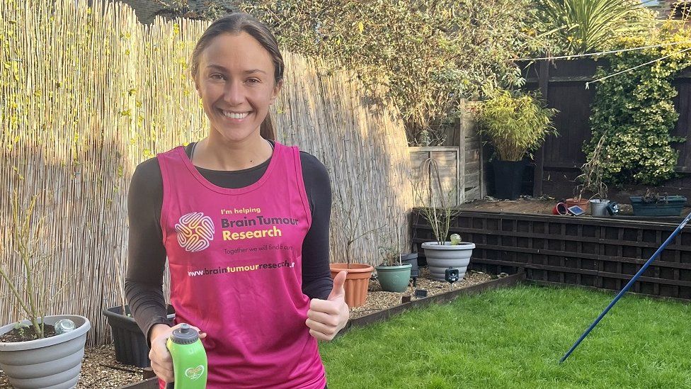 Mary in her Brain Tumour Research vest preparing for the London Marathon 2023