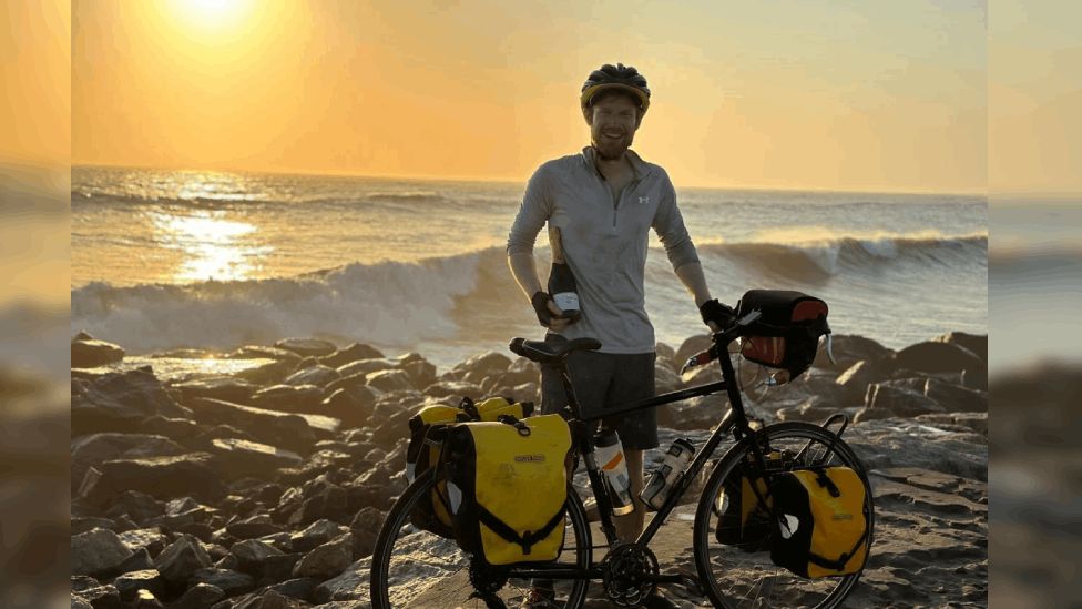 Cardiff cyclist completes ride across Africa in 28 days - BBC News