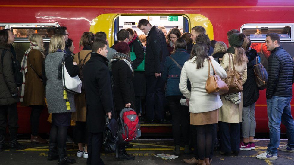 Commuters on a crowded train at Clapham Junction