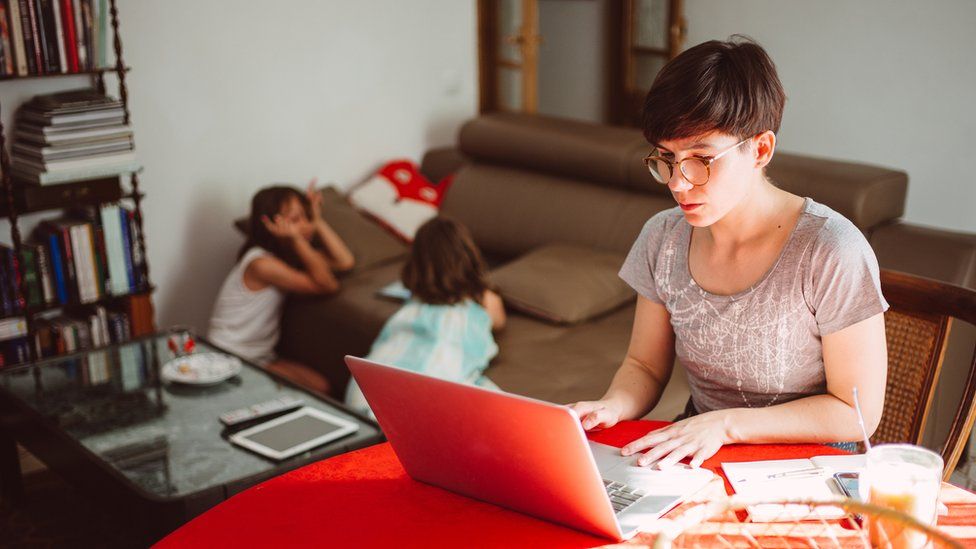 Stock picture of woman working from home