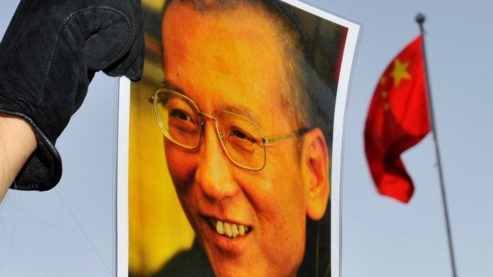 A protester holds an image of jailed dissident Liu Xiaobo outside the Chinese Embassy in Oslo, Norway on 9 December 2010.