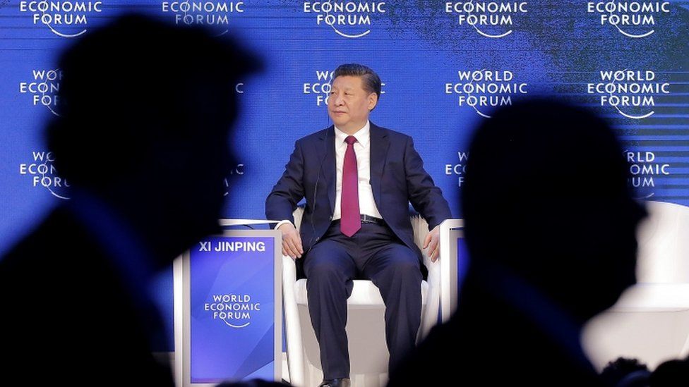 China's President Xi Jinping seated at the Davos conference