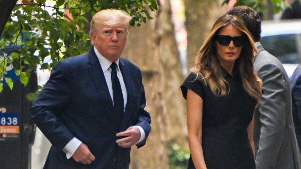 Former President Donald Trump arriving at the funeral with Melania