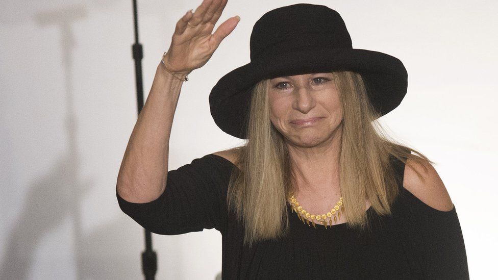 Jewish-American star Barbra Streisand waves on the stage before she receives her Philosophy honorary doctorate at the Hebrew University on June 17, 2013