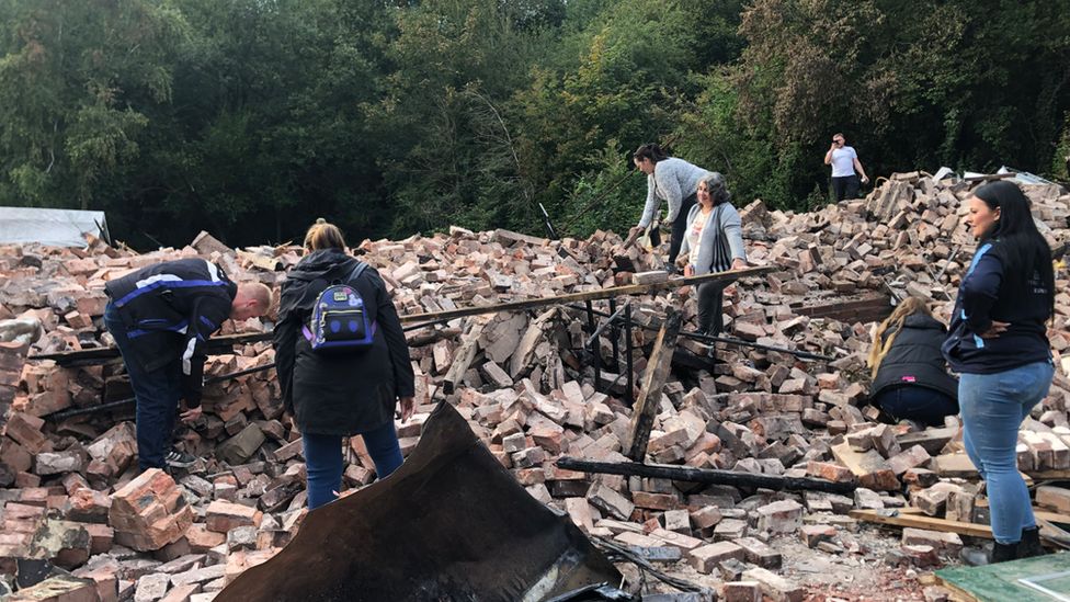 Crowds in the rubble on Tuesday