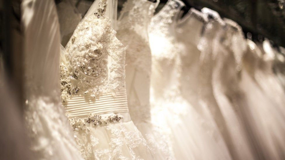 A close up image of a wedding dress