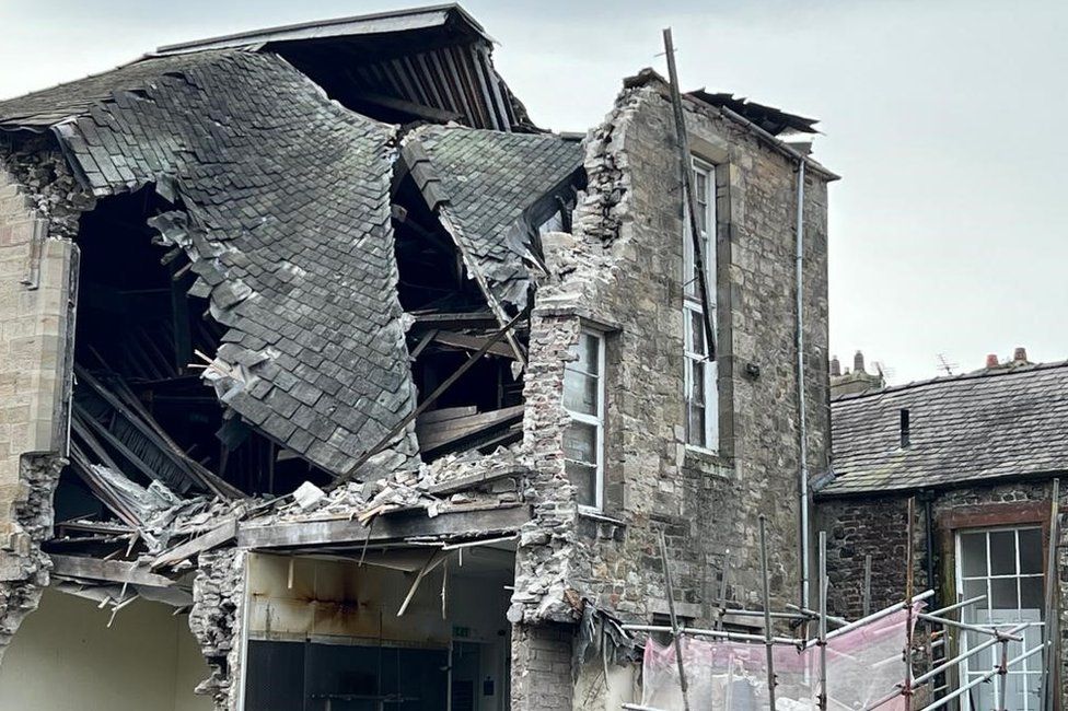 The collapsed roof of the building