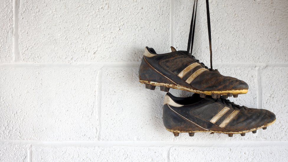 football boots hanging up