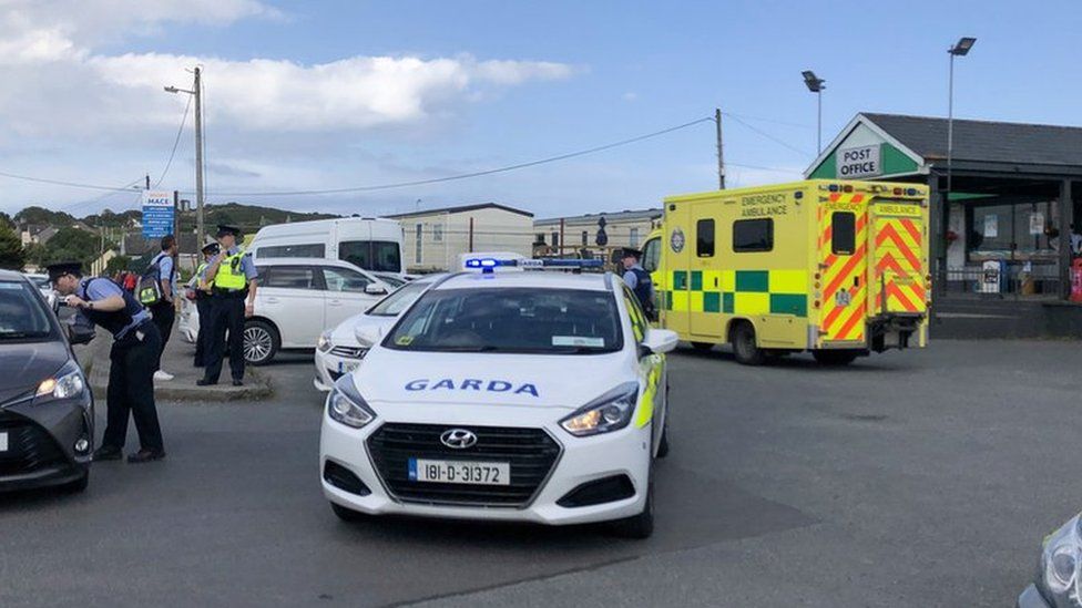 Gardaí (Irish police) stop cars near the scene of the shooting