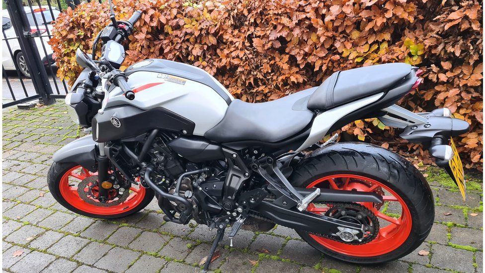 The grey Yamaha MT-07 with red wheels involved in the collision