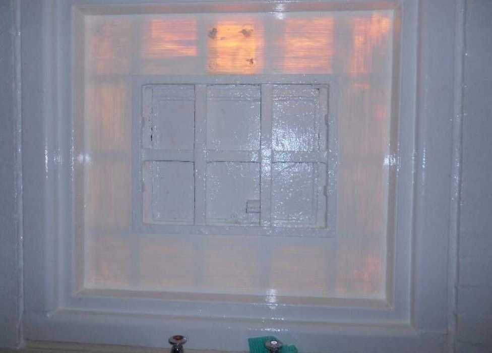 Covered up window at HMP Onley