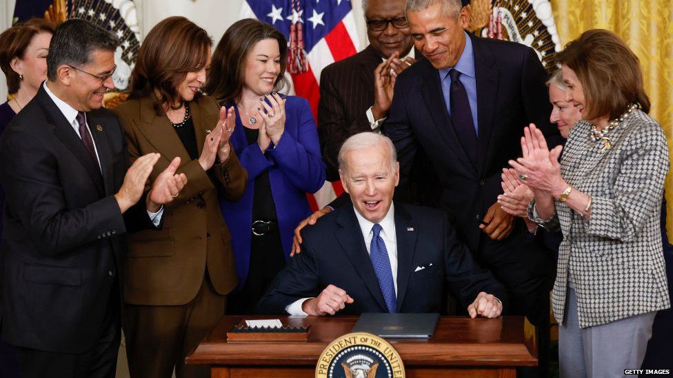 US President Joe Biden marks the passing of the Affordable Care Act with Nancy Pelosi and former president Barack Obama