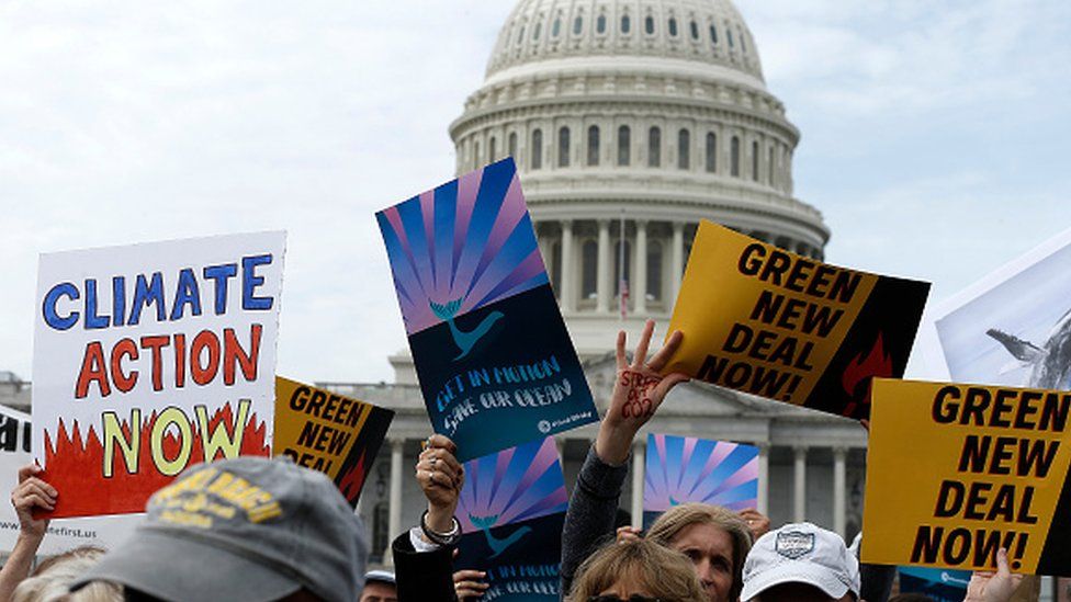 Demonstrators are seen during a climate change protest in Washington