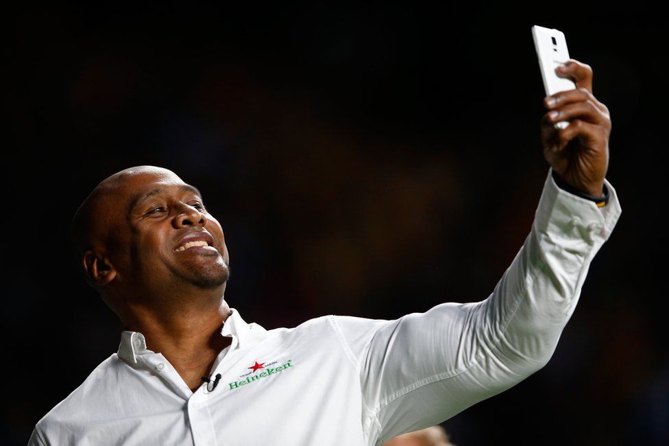 Jonah Lomu takes a selfie during the 2015 Rugby World Cup final match between New Zealand and Australia on 31 October