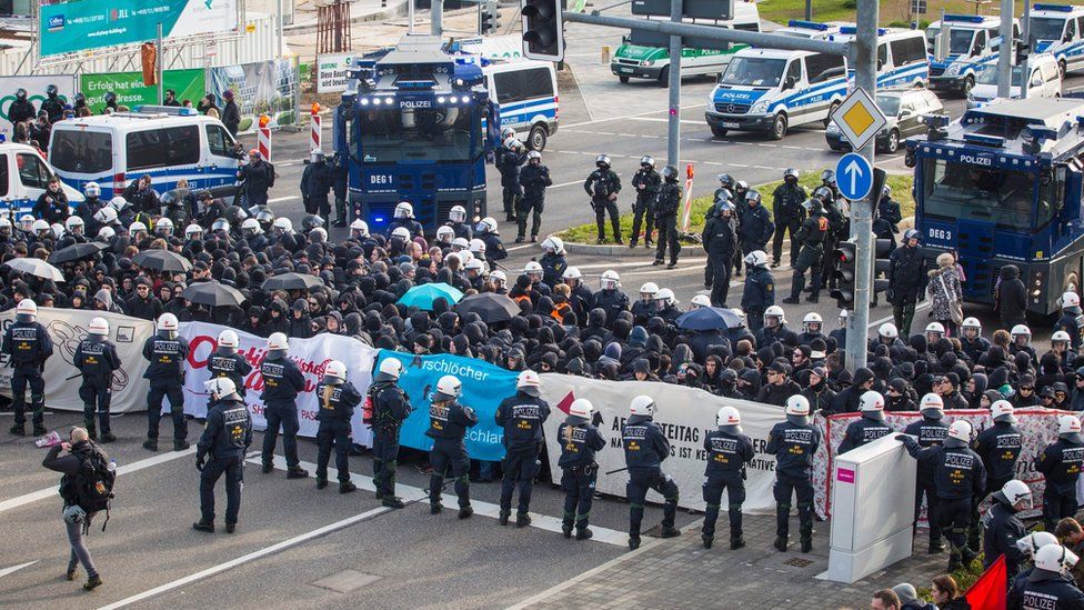 German police surround protesters who tried to block off access to the exhibition centre where the Alternative for Germany (AfD) is to hold its party convention, in Stuttgart, Germany, 30 April 2016