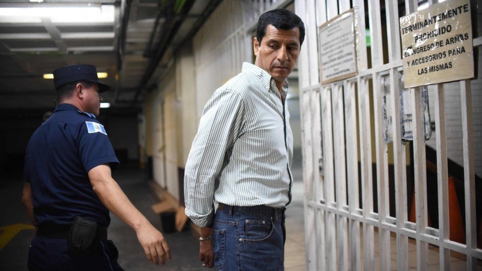 Guatemalan former Defence Minister Manuel Lopez Ambrosio arrives at a courthouse after being arrested in Guatemala City