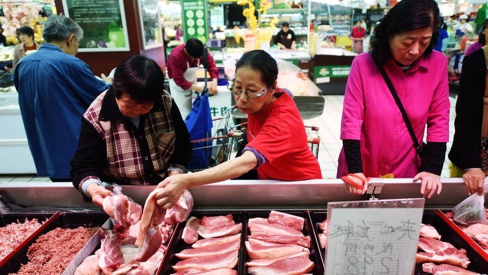 Chinese consumers shop for pork