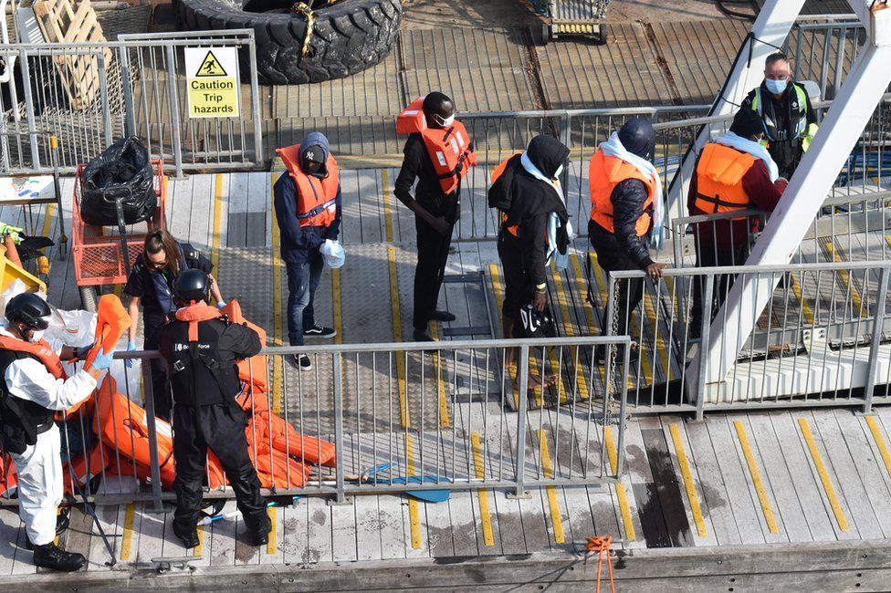 Migrants arriving in Dover, shepherded by the Border Force