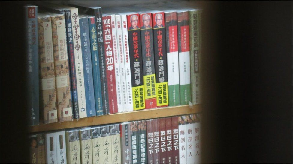 Books in the shop, seen through a window