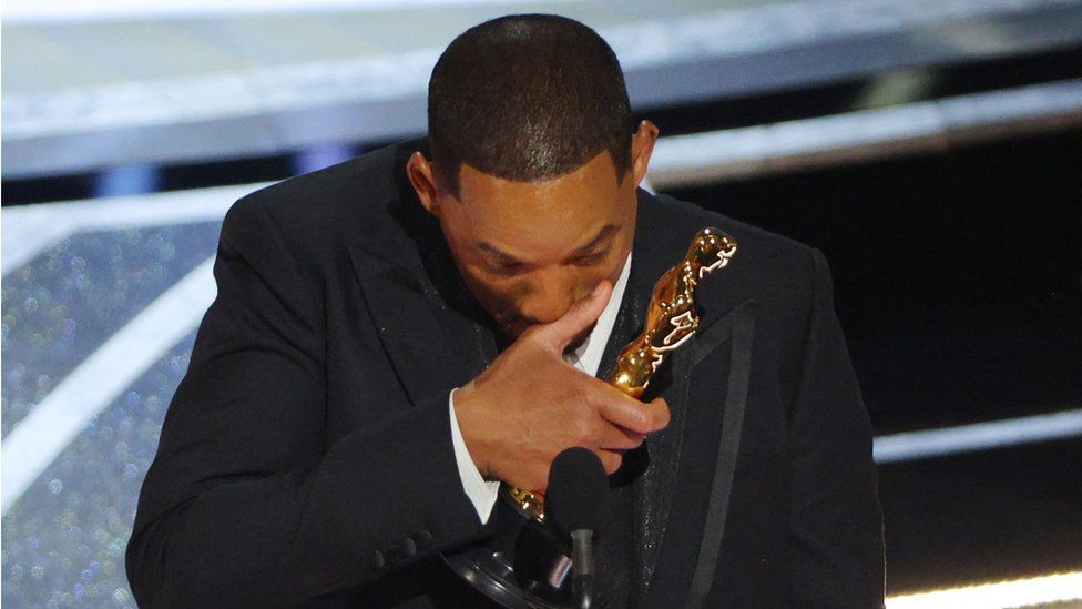 Will Smith wiping his nose during his tearful Oscars acceptance speech