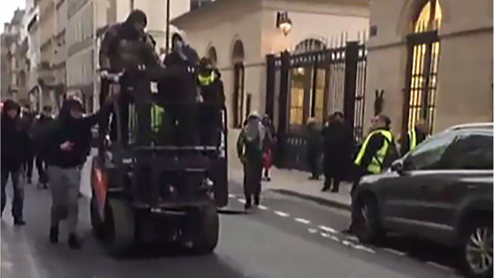 Protesters on a forklift truck in Paris, 5 January